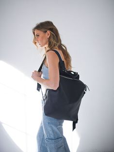 Extremely comfortably and super stylish black backpack for simple walk or for important day at the office. Choose this timeless leather handbag for your capsule wardrobe. Backpack "Agave" - she only feels alive when soaking up warm sun beams, enjoying fresh Southern wind and experiencing endless adventures. DETAILS: ◾️Measurements: 35 x 30 x 10 cm (13.8 x 11.8 x 3.9 in). ◾️Prolonged handle at the top so it's comfortable to easily pick it up and carry in your hand. ◾️Leather loops with little car Versatile Leather Satchel Backpack For Commuting, Soft Leather Backpack For Commuting, Leather Backpack With Adjustable Strap For On-the-go, Modern Leather Travel Backpack, Modern Soft Leather Satchel Backpack, Modern On-the-go Standard Backpack, Modern Leather Backpack With Leather Handles For Everyday, Versatile Leather Backpack With Zipper Closure, Modern Leather Satchel Backpack With Large Capacity