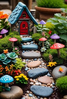 a garden with rocks, plants and small houses