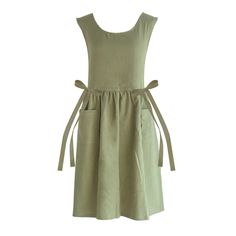 a green dress with straps on the waist