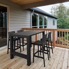 a table and chairs on a wooden deck