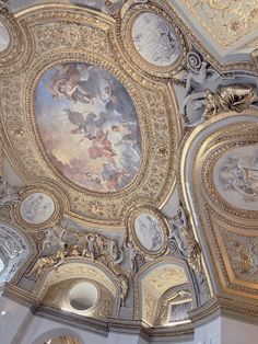 an ornate ceiling with paintings on it