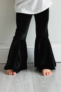 Super soft black velvet pants. Ready to ship! Size Chart - Crotch to hem 12 month - 10 inches 18 month - 10 1/2 inches 2T - 11 1/2 inches 3T - 12 1/2 inches 4T - 13 1/2 inches 5T - 14 1/2 inches 6 - 16 1/2 inches 7 - 17 1/2 inches 8 - 18 1/2 inches 10 - 21 1/2 inches 12 - 22 1/2 inches Black Velvet Pants For Party, Fitted Black Velvet Pants, Black Fitted Velvet Pants, Black Stretch Velvet Pants, Pumpkin Dress, Black Velvet Pants, Flutter Dress, Ruffle Pants, Velvet Pants