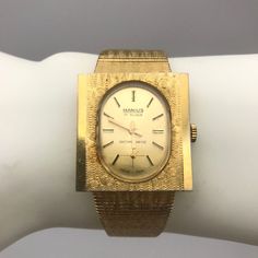 "Rare Beautiful Manius 17 Rubis Antimagnetic Gold Vermeil mechanical Watch Marked Swiss Made on face, Band is marked \"made in Italy\" on clasp. Separate second hand on bottom. Beautiful watch. I could find no other one like it. Condition: Good vintage condition (See Photos) Some of the gold plating is rubbed off slightly on the inside of the band Adjustable Band The mechanism is winding, mechanical, 17 Rubis. I believe that most of the watch is made from silver with gold plate (Vermeil) It is n Gold Chronometer Watch Timeless Style, Gold Jewelry And Watches With Chronometer, Antique Gold Watches With Subdials, Gold Rectangular Chronometer Watch, Gold Timeless Chronometer Watch Accessories, Vintage Yellow Gold Watch With Rectangular Dial, Victorian Gold Watch With Chronometer, Victorian Style Gold Watch With Chronometer, Timeless Gold Watches