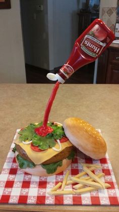 a toothbrush sticking out of a hamburger on top of a red and white checkered table cloth