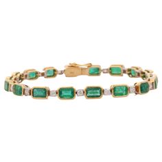 This Emerald and Diamond Tennis Bracelet in 18K gold showcases 18 endlessly sparkling natural emerald, weighing 10.25 carats and 18 pieces of diamonds weighing 0.78 carats. It measures 7 inches long in length. Emerald enhances the intellectual capacity of the person. Designed with perfect octagon cut emerald set horizontally in bezel setting with diamond after each emerald to make you stand out on any occasion or event. The elegant style complements the attire beautifully and this is a perfect U Emerald Set, Emerald Bracelet, Mother Daughter Gifts, Classic Bracelets, Diamond Tennis Bracelet, White Gold Bracelet, Sapphire Bracelet, Tennis Bracelet Diamond, Emerald Diamond