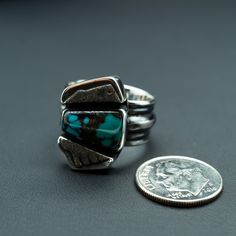 This piece features a piece of natural Turquoise balanced between two beautifully unique silver boxes. During your day, we envision this ring will remind you that balance leads to harmony, and your harmony is vital to your wellbeing. Perfect for any outfit, this ring wears well any day of the week. Natural Turquoise and .925/.999 silver. This ring is a size: 9(US) Setting size: 15X22mm (stone 14X8mm) Sterling Silver Turquoise Ring For Healing, Sterling Silver Turquoise Ring For Healing With Natural Stones, Artisan Turquoise Ring With Polished Finish As Gift, Gift Turquoise Ring With Polished Finish, Unique Polished Turquoise Ring For Gift, Unique Stackable Turquoise Jewelry, Unique Turquoise Stackable Jewelry, Spiritual Turquoise Ring With Natural Stones In Sterling Silver, Healing Sterling Silver Turquoise Ring