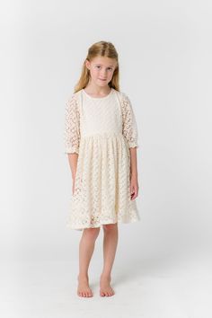 All over lace girl's dress 1/2 length sleeves Round neckline Gathered waist Button back closure Fabric content - Cotton - Dry clean only Lace Dress With 3/4 Sleeves And Lace Trim, Modest Lace Dress With Lace Sleeves, Spring Dress With Lace Sleeves And Half Sleeve, Short Sleeve Cream Lace Dress, Cream Short Sleeve Lace Dress, Spring Confirmation Lace Dress, Spring Lace Dress With Half Sleeves, Spring Lace Dresses With Half Sleeves, Spring Half-sleeve Lace Dresses