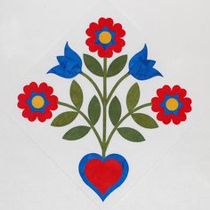 a red, white and blue flower arrangement on a white background with a heart in the center