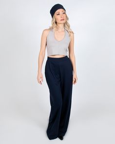 These are the ultimate wide leg palazzo pant. They are high-waisted and have pockets for optimum comfort and style. They look sleek for a business meeting, super cool at the studio, and really hot for a night out. PRODUCT DETAILS: - 60% Rayon, 33% Nylon, 7% Lycra- Moisture wicking and four-way stretch - Machine washable and dryer safe - MADE IN USA - Model: Talia is 5'4" is wearing a size Small View our shipping and returns policy We'd love to hear from you! Email hello@paridaez.com with any que Chic Wide Leg Dress Pants For Business Casual, Chic Wide Leg Full Length Pants, Trendy High Waist Wide Leg Pants For Date Night, Solid High Waist Wide Leg Pants For Date Night, Trendy High Waist Wide Leg Evening Pants, Versatile Wide Leg Business Casual Pants, Versatile Wide Leg Pants For Business Casual, Versatile Business Casual Wide Leg Pants, Solid Color Wide Leg Bottoms For Date Night