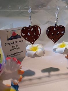 A beautiful set of Hawaiian Heart Earrings made from solid Koa Wood and 925 Sterling Silver findings.  A gift  that says "I love You" and includes lots of Aloha from the Hawaiian Islands.  Perfect Mother's Day Gift, Birthday and Anniversary Gift that shares Aloha & Love.  Handmade in my studio in Volcano Hawaii.   FREE Gift Box Included. FREE First Class Shipping. Priority Mail Upgrade: $ 4.50 Heart-shaped Pierced Earrings For Mother's Day, Pierced Double Heart Earrings For Mother's Day, Double Heart Pierced Earrings For Mother's Day, Valentine's Day Gift Earrings, Mother's Day Gift Earrings With Heart Charm, Heart-shaped Pierced Earrings For Gift, Round Earrings With Heart Charm As A Gift, Sterling Silver Earrings For Mother's Day Anniversary, Sterling Silver Earrings For Anniversary