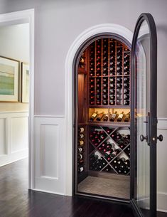 a wine cellar in the corner of a room