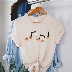 Pumpkin Music Note T-shirt Fall Music Teacher Tee Halloween - Etsy Fall Music-themed Graphic Print T-shirt, White T-shirt For Fall Concert, White T-shirt For Concerts In Fall, Fall Music-themed Cotton Tops, Boy Mom Shirt, Mom Graphic Tees, Halloween Tee Shirts, Mom Of Boys Shirt, Auntie Shirts