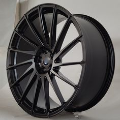 a black wheel on a white background