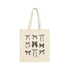 PRODUCT INFO: This 100% cotton bag comes in one size - 15" x 16"- perfect for everyday wear. While the canvas material will show off your designs in great colors, it's durable and will last for years. The bag features 20" handles (made from the same canvas), making it easy to carry even with a week's worth of shopping. - 100% cotton canvas - Available in natural and black colors - Heavy fabric (12 oz/yd² (406.9 g/m - Sewn-in label PROCESSING: - Processing time is approximately 2-5 business days. Trendy Cotton School Bag, Trendy Cotton Bag For Daily Use, Trendy Cotton Canvas Bag With Adjustable Strap, Cotton Canvas Shoulder Bag For Shopping, Cotton Canvas Bag With Adjustable Strap As Gift, Trendy Cotton Canvas Shoulder Bag, Trendy Cotton Shopping Bags, Black Cotton Canvas School Bag, Black Rectangular Cotton Bag