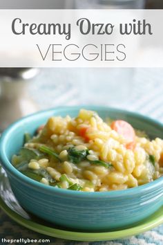 creamy orzo with veggies in a blue bowl