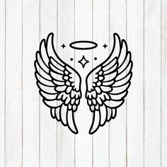 an angel wing with halo and stars in the center on a white wooden wall background