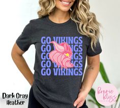 This bright Vikings shirt is perfect for Viking fans, teachers, and students!  The colors make it unique, and the style is perfect for game day or any day!  * Bella Canvas 3001 * Unisex Adult Sizing * Listing is for shirt ONLY, props and other articles of clothing are not included BELLA CANVAS CREWNECK TEE * This classic unisex jersey short sleeve tee fits like a well-loved favorite. Soft cotton and quality print make users fall in love with it over and over again. These t-shirts have-ribbed knit collars to bolster shaping. The shoulders have taping for better fit over time. Dual side seams hold the garment's shape for longer.  -Solid colors are 100% cotton, heather colors are 52% cotton, 48% polyester, (Athletic Heather and Black Heather are 90% cotton, 10% polyester.  -Runs true to size Pink Tops With Team Name For Fan Gear, Casual Pink Tops With Team Logo, College Shirt With Graphic Print In Pink, Pink Graphic Print Shirt For College, College Graphic Print Pink Shirt, Pink Team Spirit T-shirt For Fans, Pink Tops Team Spirit Fan Gear, Pink Team Spirit Tops For Fan Gear, Pink Tops For Fan Gear With Team Spirit