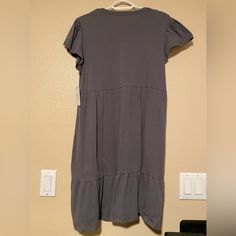 Gray Ruffled Dress Fits Loose. Size Small (4-6). Never Worn New With Tags. Brand Is Time And Tru. Casual Cotton Dresses With Ruffle Hem, Relaxed Fit V-neck Dress With Ruffles, Casual Tiered Cotton Dress, Casual Cotton Tiered Dress, Casual Midi Dress With Flutter Sleeve And Ruffle Hem, Casual Dresses With Flutter Sleeve And Ruffle Hem, Cotton Midi Dress With Ruffle Hem And Short Sleeves, Cotton Midi Dress With Ruffles And Short Sleeves, Relaxed Fit Ruffled Dresses For Daywear