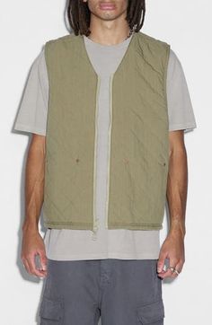 Introduce the ultimate layering workhorse to your wardrobe with this zip-front cotton vest boasting a quilted design that reverses to a solid alternative. 27" length Front zip closure V-neck Front patch pockets 100% cotton Machine wash, line dry Imported Khaki Vest, Summer Wardrobe Essentials, Reversible Vest, Cotton Vest, Vests Mens, Mens Khakis, Sports Blazer, Made Clothing, Denim Leggings