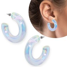 1 pair of acrylic earrings Immerse yourself in the world of subtle shine with our transparent iridescent acrylic hoop earrings. These elegant earrings catch the light in a magical way and add a subtle yet fascinating touch to your look. Made from high-quality acrylic, they are as light as a feather and are therefore perfect for all-day wear. The classic hoop shape gives any outfit a timeless elegance, while the iridescent finish exudes a touch of mystery and glamour. Whether in the office or at a dinner party, these earrings are the ideal accessory for a touch of sophisticated beauty. Material: acrylic resin Dimensions: Ø 38 mm, thickness approx. 8 mm Colour: transparent - rainbow - iridescent Scope of delivery: 2 pieces Cheap Trendy Rainbow Hoop Earrings, Modern Clear Hoop Earrings, Cheap Rainbow Nickel-free Hoop Earrings, Cheap Statement Resin Hoop Earrings, Iridescent Acrylic Earrings, Hoop Earring Outfit, Beautiful Stud Earrings, Acrylic Earrings, Elegant Earrings