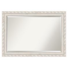 an ornate white framed mirror on a white wall with beaded trimmings and a decorative border around the edge