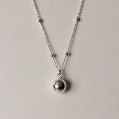 Sterling Silver Satellite Sphere Pendant Necklace sphere pendant dimensions: 8mm wide x 10mm drop material: Sterling Silver. Dangle Ball Chain Jewelry, Sterling Silver Ball Chain Jewelry Gift, Silver Teardrop Charm Necklace With Clavicle Chain, Pendant Jewelry With Ball Chain As Gift, Silver Adjustable Drop Necklaces, Sterling Silver Pendant Necklace With Ball Chain, Minimalist Jewelry With Round Pendant Ball Chain, Minimalist Jewelry With Ball Chain And Round Pendant, Silver Round Drop Necklace In Dainty Style