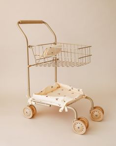 a shopping cart with wheels and a basket on top