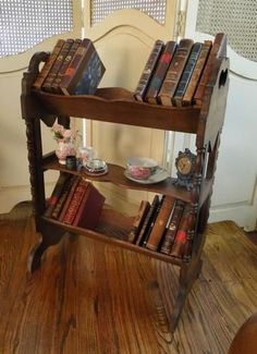 an old wooden book shelf with books on it