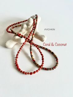 Beautiful coral and coconut natural  necklaces, made with 3-4m beads with a touch of the silver quality Czech glass seed beads. Get for yourself or gift to a friend. ♥   #vichkin #vichkindesign ↠ ABOUT    ▢  Size: about 15 inch, goes up to about 17 inch with chain extension.  ▢  Materials: 2mm quality Czech glass seed beads and 3-4mm coral beads and 4mm coconut beads.  ▢  This item is handmade and may vary slightly from the picture, making every one completely unique.  ▢  Ready to ship.  ↠ IMPOR Red Heishi Beads Jewelry For The Beach, Red Beaded Necklaces For Summer Vacation, Adjustable Single Strand Beaded Necklace In Red Coral, Red Beads For Beach And Summer, Handmade Red Heishi Beads Necklace, Red Beaded Necklaces With Colorful Beads For Vacation, Handmade Coral Beads For Beach, Red Coral Necklaces For Beach, Red Round Beads Jewelry For Vacation