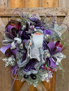 a wreath with a gnome and snowflakes on it