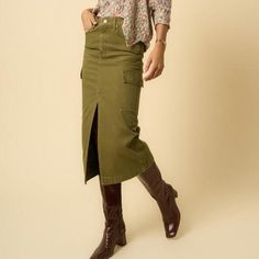 Introducing our Olive Cargo Midi Skirt, a must-have for those who appreciate the blend of functionality and style. This skirt is crafted from 100% cotton, ensuring breathability and comfort throughout the day. It features a practical front zipper fly for ease of wear and multiple pockets that not only add a utilitarian touch but also enhance its overall aesthetic. Presented in a rich, true olive color, this cargo skirt offers a versatile look that can be easily dressed up with a blouse and heels Green Cotton Cargo Skirt With Side Pockets, Green Utility Mini Skirt, Green Cotton Fall Skirt, Fall Green Cotton Skirt, Khaki Cotton Cargo Skirt With Side Pockets, Casual Green Cotton Cargo Skirt, Green Cotton Skirt With Pockets, Green Cotton Midi Skirt, Utility Cotton Cargo Skirt For Fall