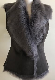 Fitted winter vest made from Grey Toscana lambskin, silky to the touch, suede top finish, cozy silver grey fur interior and large collar, with a raw natural asymmetrical hemline and fastened with one big flat button or two leather straps to tie. Also you can wear with any belt for different style outfit. Back length from neck to the bottom about 62cm. Size S, M, L For best fit email me your measurements. Fitted Waistcoat, Sheepskin Vest, Grey Fur, Suede Tops, Winter Vest, Sleeveless Jacket, Leather Top, Different Styles, Brown And Grey