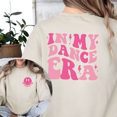 Celebrate the dance era with our "In My Dance Era" Sweatshirt, designed for dance moms and young dancers alike. Whether it's for a cheer mom hoodie or a kids dance shirt for girls, this youth dance shirt is the perfect gift idea for members of any dance team, honoring their passion with style and comfort. 💃🏼 LINKS TO OTHER DANCE SHIRTS💃🏼 https://etsy.me/3ULH1w0 👕 WHAT YOU ARE GETTING -In My Dance Era Shirt -Order in a sweatshirt, hoodie or t-Shirt -Order in adult or youth size 💲 HOW TO ORD Girls Gift Idea, Dance Shirt, Dance Stuff, Company Shirts, Dance Shirts, Mom Hoodies, Dance Team, Cheer Mom, Dance Teams