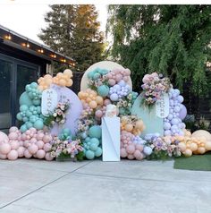 balloons and flowers are arranged in the shape of letters