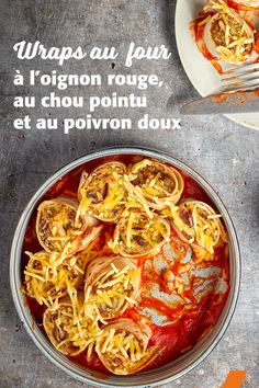 a bowl filled with pasta and sauce next to a plate full of pizza on a table