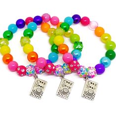 These adorable stretchy charm bracelets are the perfect favor for your little one's cooking themed party! Each bracelet features a Tibetan silver charm, resin rhinestone beads and an assortment of bright rainbow 10mm beads strung with durable stretch floss cord. Each bracelet will arrive individually packaged in organza bags. Please select the size needed from the drop down menu. If you need more than one size, just leave a note during checkout with the quanity and ages. Please message me if you Multicolor Charm Bracelet With Round Beads For Birthday, Playful Hypoallergenic Charm Bracelet For Birthday, Playful Multicolor Craft Supplies For End Of School Year, Novelty Multicolor Jewelry For Party Favors, Rainbow Bracelets With Large Beads As Gift, Cute Multicolor Party Supplies For Gift, Novelty Multicolor Beaded Bracelets For Birthday, Playful Multicolor Stretch Bracelet For Party Favors, Multicolor Novelty Stretch Bracelet For Birthday