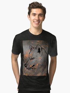 a man wearing a black t - shirt with an image of a wolf on it