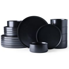 black dinnerware is stacked on top of each other