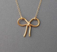 bow necklace! Gold Bow Necklaces For Gifts, Gold Necklaces With Bow For Gifts, Gold Necklaces With Bow As Gifts, Gold Necklace With Bow For Gifts, Gold Necklace With Bow As Gift, Elegant Gold Jewelry Gift Wrapped, Gold Plated Bow Jewelry Gift, Gold Plated Bow Jewelry For Gift, Minimalist Gold Jewelry With Bow