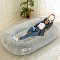 a woman laying on an inflatable bed that is made to look like a couch