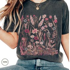 Colorful wildflower Comfort Colors shirt. Perfect for boho, cottagecore and botanical lovers, this comfortable flower shirt makes a great Christmas gift for moms and teen girls who love a floral, nature-inspired aesthetic. GET YOURS NOW ♡ P R O D U C T∙ D E T A I L S * Brand: Comfort Colors * Fabric: 100% ring-spun cotton. Medium weight * Fit: Relaxed fit. Runs large * Your shirts are carefully made with attention to small details ♡ C A R E ∙ I N S T R U C T I O N S * Turn inside out. Cold water wash with like colors only * Mild detergent. Do not bleach * Do not iron design area * Do not dry clean H O W ∙ T O ∙ O R D E R * Select a Color * Select a Size - Please see the Size Chart * Add to Cart * Please check the Shipping Address to ensure that your order arrives without delay Y O U R ∙ P Floral Cottagecore, Iron Design, Inspired Aesthetic, Boho Cottagecore, Comfort Colors Shirt, Flower Shirt, Small Details, Colorful Boho, Christmas Gifts For Mom