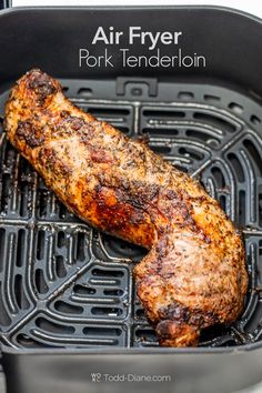 grilled meat on top of an air fryer with the words air fryer pork tenderion