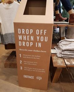 a brown cardboard box that says drop off when you drop in