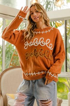 Get your gobble on with the Gobble Gobble Sweater! This playful sweater will have you looking festive and feeling cozy. Perfect for Thanksgiving or any chilly day, it's a must-have for those who love a good laugh. No serious turkeys allowed! Rompers Dressy, Gobble Gobble, Jumpsuit Skirt, Skirt Leggings, Love A, Short Pants, Jacket Dress, Sweater Top, Dress Skirt