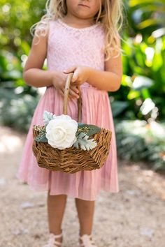 "/ MEET WILLOW ---------------------- A handmade wicker flower girl basket in natural, peeled willow. Bristol features lush artificial greenery and is accented with a handmade chiffon fabric flower. Inspired by rustic weddings, she's perfect for flower girls of all ages. / ADDITIONAL DETAILS ---------------------- * Basket dimensions: 9\"L x 7\"W x 4.5\"H (10\"H w/ handle) * Sturdy, woven peeled willow basket * Single, fixed handle for easy carrying / PURCHASE OPTIONS --------------------------- Flower Girl Basket Ideas, Diy Flower Girl Basket, Rustic Flower Girl Basket, Willow Wedding, Flower Girl Basket Rustic, Basket Willow, Greenery Wedding Decor, Willow Basket, Spring Garden Wedding