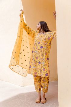 Cotton Yellow Printed Suit Set with Doriya Dupatta The set consists of printed kurta teamed with matching printed pajama and a doriya dupatta with embroidery detailing Kurta Length-39 inches Palazzo Length-34 inches Dupatta Length-2.5 meters Work-Print Detailing Color-Yellow Kurta Fabric-Cotton Bottom Fabric-Cotton Dupatta Fabric-Doriya Model Size- 5.8 tall wearing small size Sleeves - 3/4th Sleeves Neck-Round neck Washing Care-Hand wash or Dry Clean Yellow Kurta, Printed Pajama, Printed Suit, Embroidery Detailing, Cotton Dupatta, Cotton Bottoms, Yellow Print, Indian Ethnic Wear, Print Pajamas