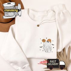 Ghost Embroidered Pocket Sweatshirt, Little Ghost with Ball Sweater, Spooky Halloween Embroidered Sweatshirt, Bat Embroidered Sweatshirt ⚠️⚠️⚠️ Looking for the perfect personalized gift? You Can Check Our ETSY Store for BEST PRICES and more DESIGNS: https://customembroidermerch.etsy.com 👉Follow these steps to purchase: 1. Choose the color of the sweater 2. Add the product to your cart 3. Repeat the process for additional sweaters you want to purchase. 4. Finalize your order The sweaters are 100% cotton, but the Dark Heather and heather colors are 65/35 polyester/cotton. Please refer to the size chart before making your purchase. Unfortunately, we cannot accept returns or exchanges at this time, but if you encounter any issues with your order please feel free to contact us. If you have any Halloween White Sweatshirt With Embroidered Graphics, White Halloween Sweatshirt With Embroidered Graphics, Halloween Embroidered Cotton Tops, Spooky White Cotton Sweatshirt, Halloween Cotton Embroidered Tops, White Spooky Cotton Sweatshirt, White Cotton Spooky Sweatshirt, White T-shirt With Embroidered Graphics For Fall, White Embroidered Graphic T-shirt For Fall