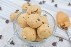 a glass bowl filled with cookies and chocolate chips