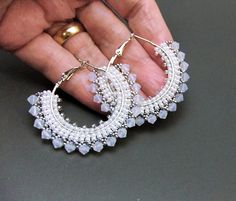 I made these lovely big beaded hoop earrings with tiny miyuki seed beads in white pearl and galvanised silver, beading round lovely great big silver plated hoops, and finishing with a row of stunning shimmering white opal premium crystal bicone beads. The beaded hoops measure 4.5 cm across (2 inches).   These stunning White Opal hoop earrings come in their own gift box, to reach you safely and securely. FREE SHIPPING with the UK Adjustable White Beaded Earrings With Spacer Beads, White Bohemian Beaded Earrings With Silver Beads, Adjustable White Beaded Earrings With Silver Beads, Bohemian White Beaded Earrings With Silver Beads, Bohemian White Beaded Hoop Earrings, White Small Hoop Beaded Earrings Nickel Free, White Round Beaded Earrings With Tiny Beads, White Bohemian Earrings With Spacer Beads, White Tiny Beaded Round Earrings