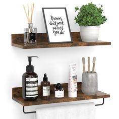 two wooden shelves with soap, toothbrushes and other bathroom items